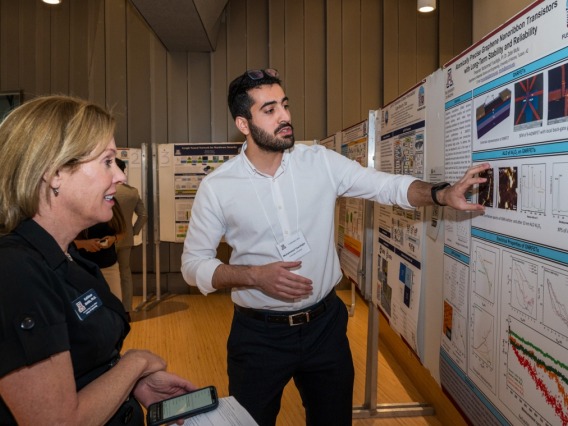 Muhammed Yusufoglu, a graduate student studying materials science and engineering, presents his research at the FuseNano 2024 conference