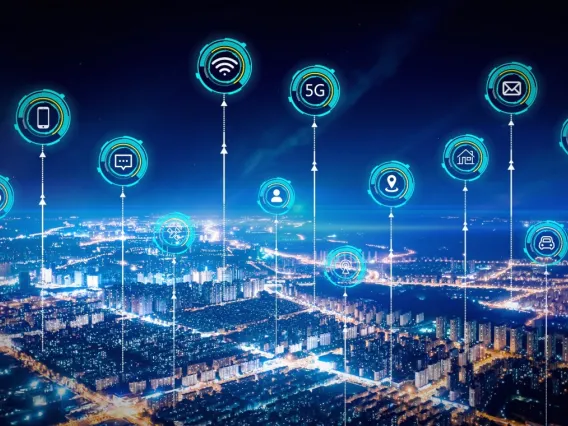 Graphic of city with tech-related icons