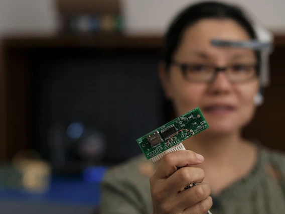 CSM Fellow Janet Roveda holds a semiconductor chip
