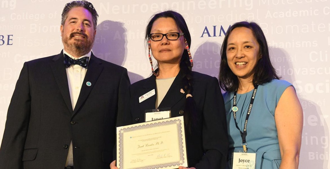 Janet Roveda, center, accepts her AIMBE fellowship certificate at the 2024 induction ceremony on March 25 in Arlington, Virginia.