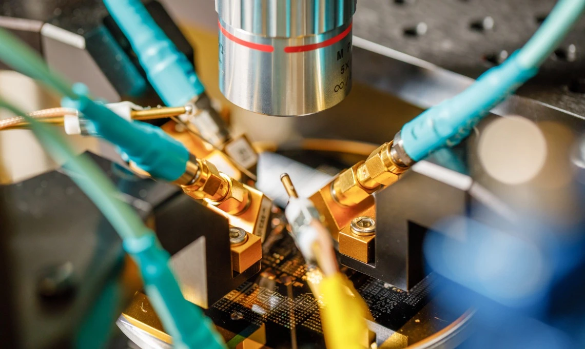 Using multiple microwave frequencies to characterize a nonlinear phononic mixing device they built on a silicon wafer.